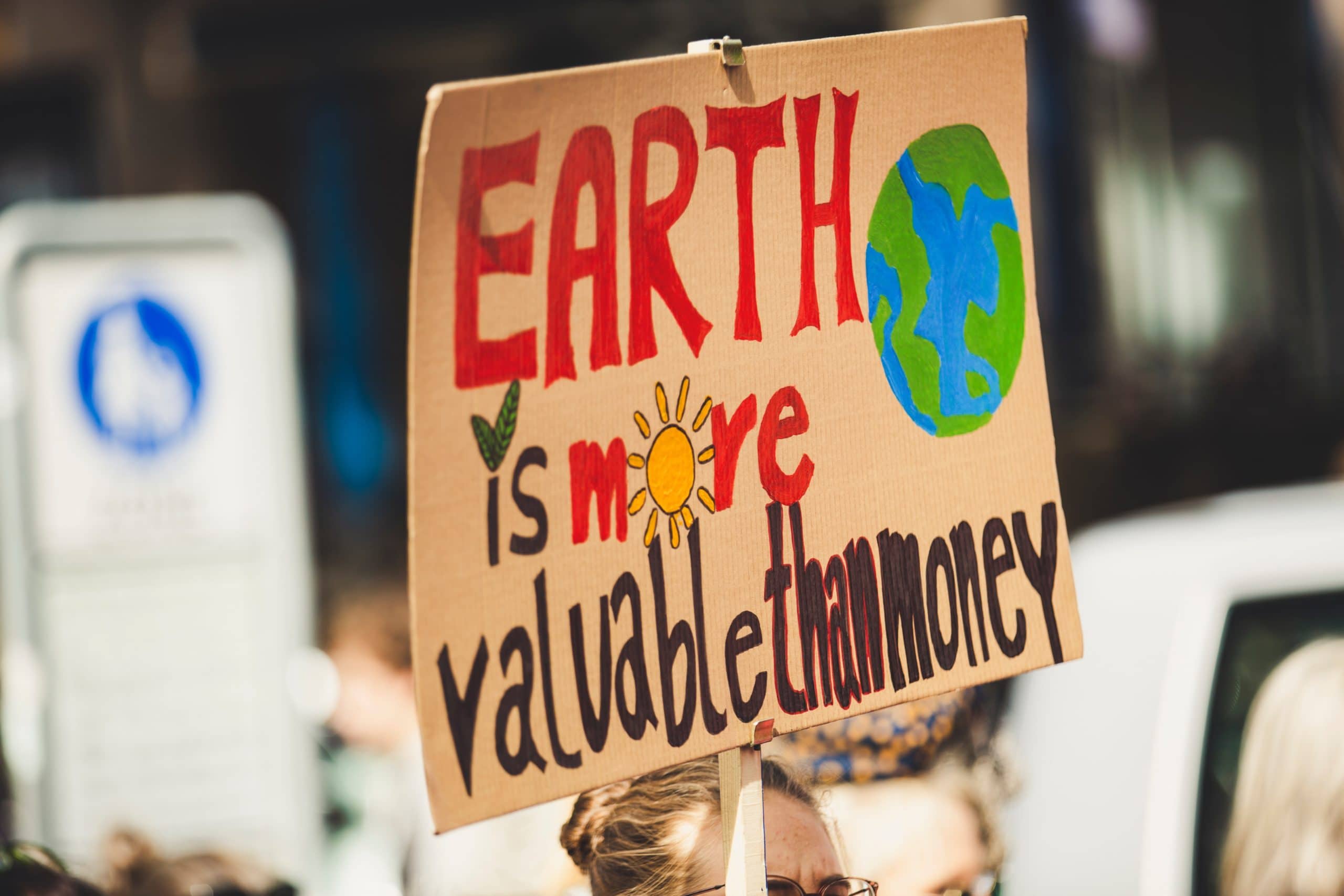 EARTH IS MORE VALUABLE THAN MONEY. Global climate change strike protest
